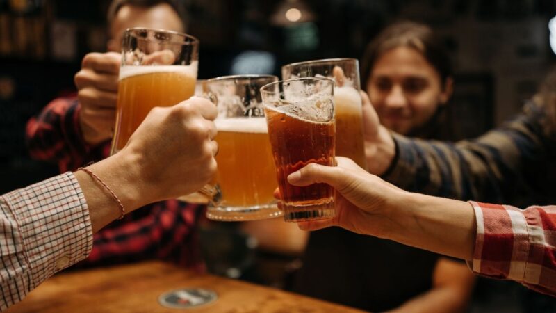 group cheers at a brewery