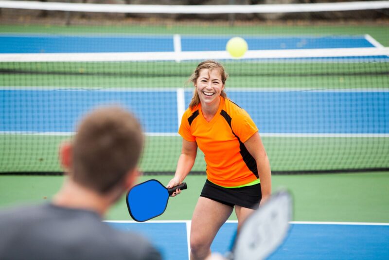 two people enjoying a game of pickleball
